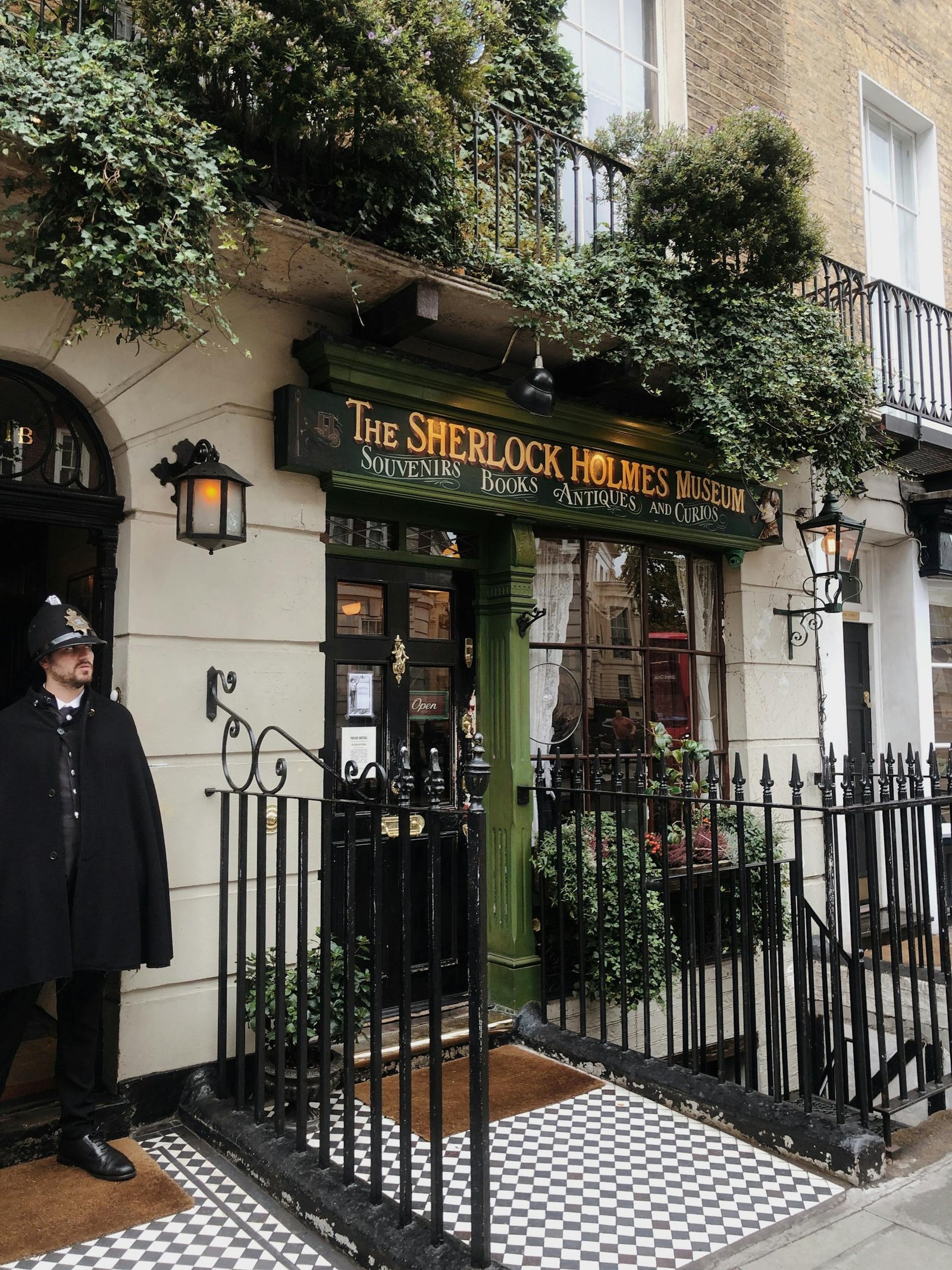 Facade of Sherlock Holmes Museum in London, with a guard in traditional uniform.